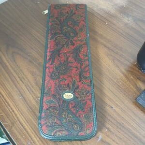 VTG Tie Rack London travel case features a red and gold paisley design zip close